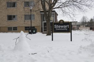 One of the many snow men around campus sits in front of Stewart.