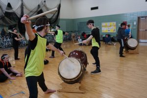 The UW Oshkosh Taiko members show off their skills.