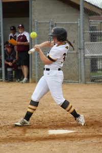 Sophomore outfielder Claire Petrus swings at a high pitch against the Eagles. On the day, Petrus had two runs knocked in.