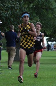 Sophomore Fabian Salinas Arroyo looks for rival runners during the final stretch of the race.