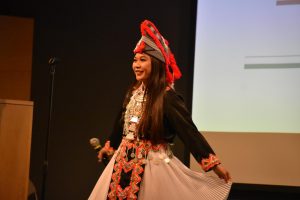 Selena Yang sings a traditional Hmong song in a traditional dress.