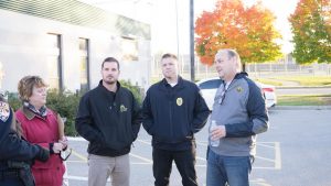 UW Oshkosh police officers Trent Martin and Chris Tarmann and UWO Chancellor Andrew Leavitt listen to students concerns during the annual campus safety walk.