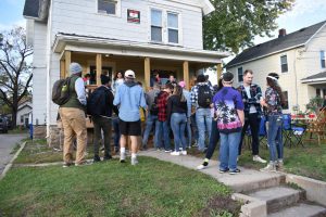 UWO students participate in pub crawl by celebrating in the front yard of a student’s home.