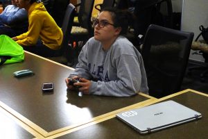 Students focus on the screen as they play games.