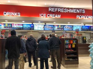 People wait in line for concessions.