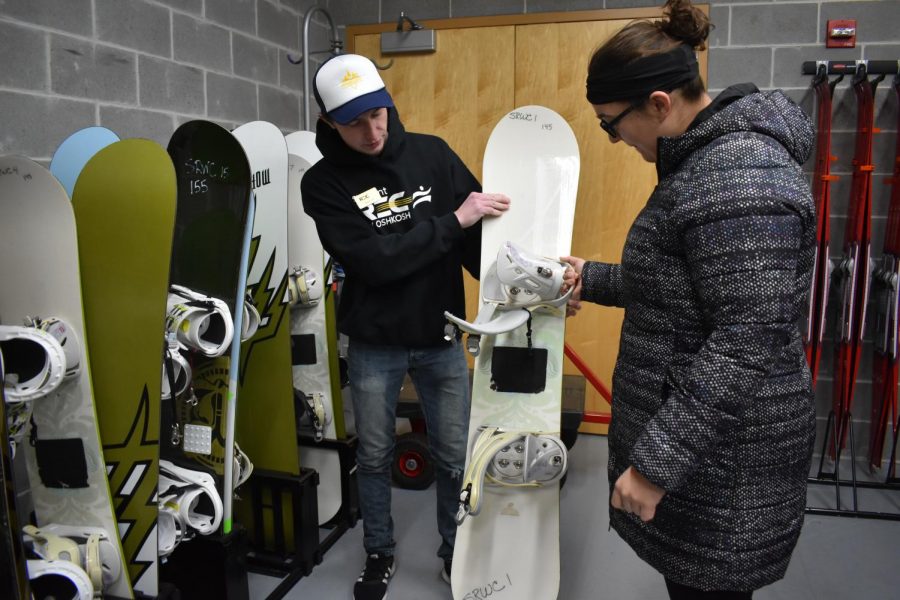 Students check out winter sports equipment including snow shoes and snowboards from the Student Recreation and Wellness Center.