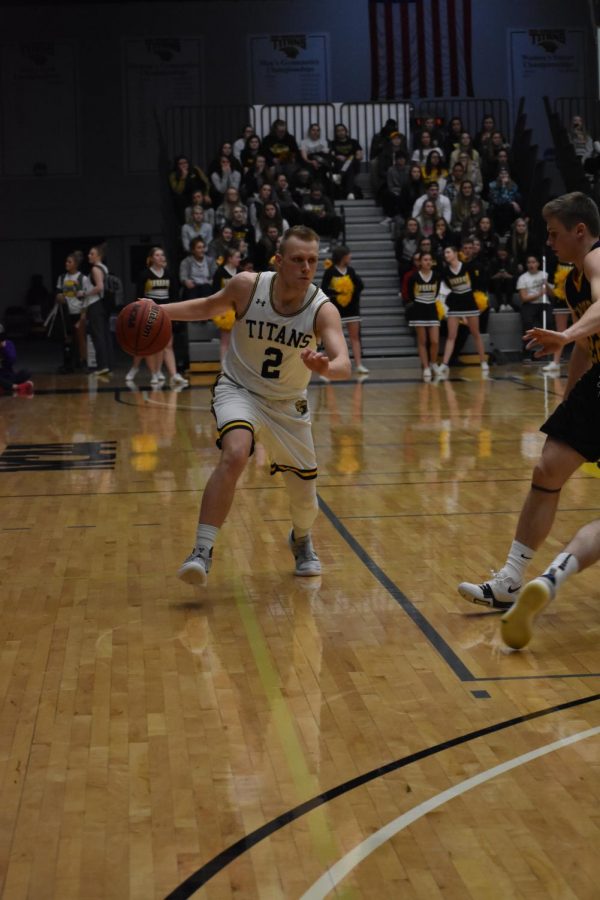 Senior Ben Boots drives to his right as he looks for a way to break down the UW-Stevens Point defense. Boots earned the WIAC Player of the Year award this season, becoming only the fifth UWO men’s basketball player to do so. 