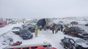 Firefighters work hard to get people out of their vehicles safely and to clean up the pieces of the 131 automobiles involved.