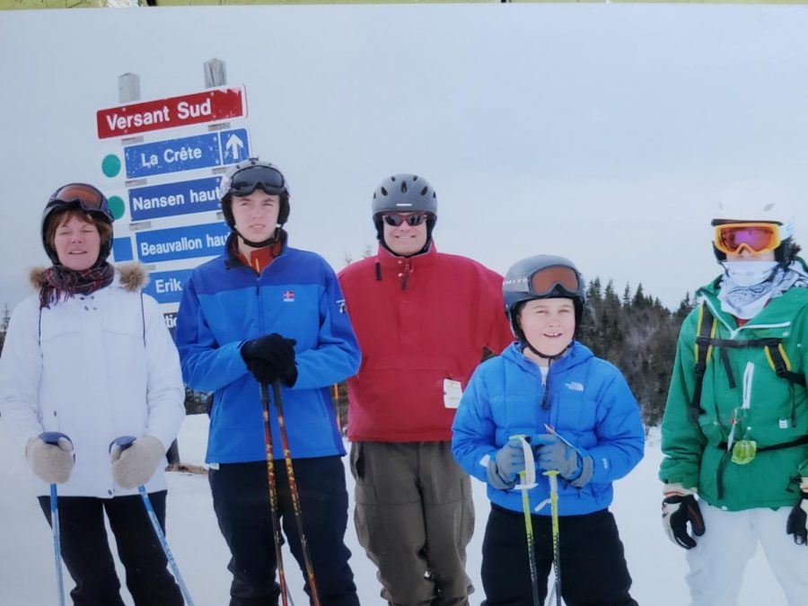 Pictured is Owen [second from left] enjoying his time skiing with family. 