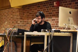 UWO senior Nathaniel Wolkoff as sound designer cues music. 