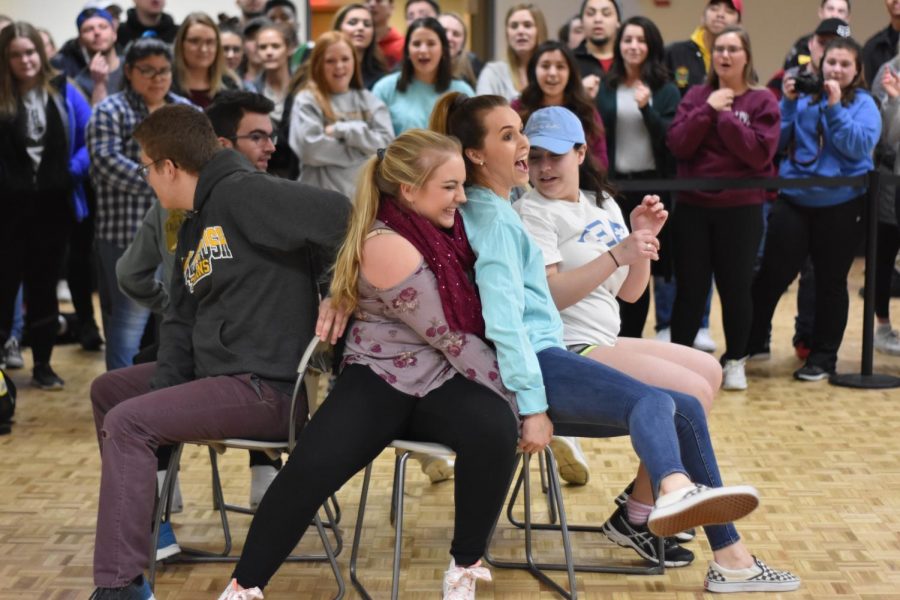 Musical chairs players compete at a Winter Carnival Week favorite