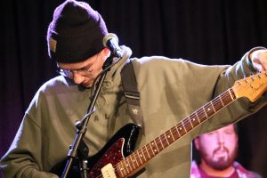 Bottom of the Lake vocalist and rhythm guitarist Brett Schlidt tunes in as he wears a Stalgic sweatshirt, the two bands have collaborated on a number of projects including a four-song digital album Split.