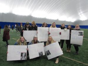 Teams show their support during broomball