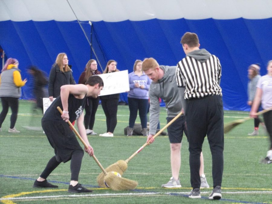 Students compete in Broomball, a sport similar to hockey.