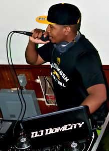 DJ Dom City speaks into the mic at Molly's
