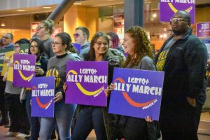 UWO students and staff participate in the 10th annual LGBTQ+ Ally March by holding a silent march in Reeve Memorial Union due to inclimate weather.