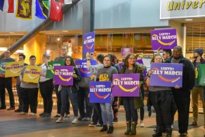 UWO students and staff participate in the 10th annual LGBTQ+ Ally March by holding a silent march in Reeve Memorial Union due to inclimate weather.