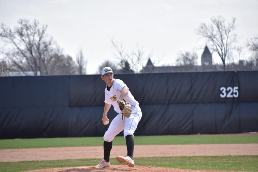 Senior Pitcher Colan Treml winds up as he delivers a pitch in the Titans first game of their doubleheader against UW-Stevens Point