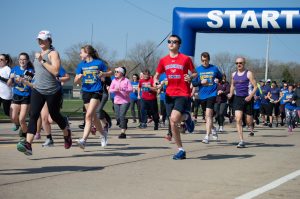 Community members, UWO students and staff participate in the annual 5K for mental health and suicide awareness at Oshkosh North High School. 