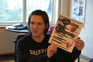 UWO alumna Brooke Berrens participates in blackout poetry for reproductive rights on Thursday.
