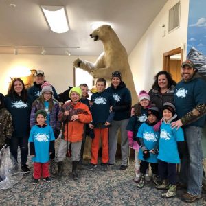 Volunteers pose for a photo to celebrate earth week.