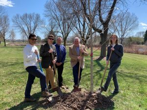 Pictured (left to right): Gilberto Castaneda, UWFDL student; Brian Kolstad, president, FDL City Council; Martin Rudd, vice chancellor, UWFDL and UWFV; Brendan Stormo, past-president, FDL Morning Rotary; and Erik Janssen, UWFDL student plant trees.