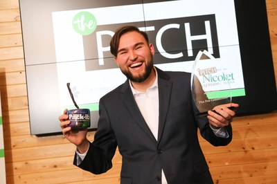 Daniel Salazar with his product and his award