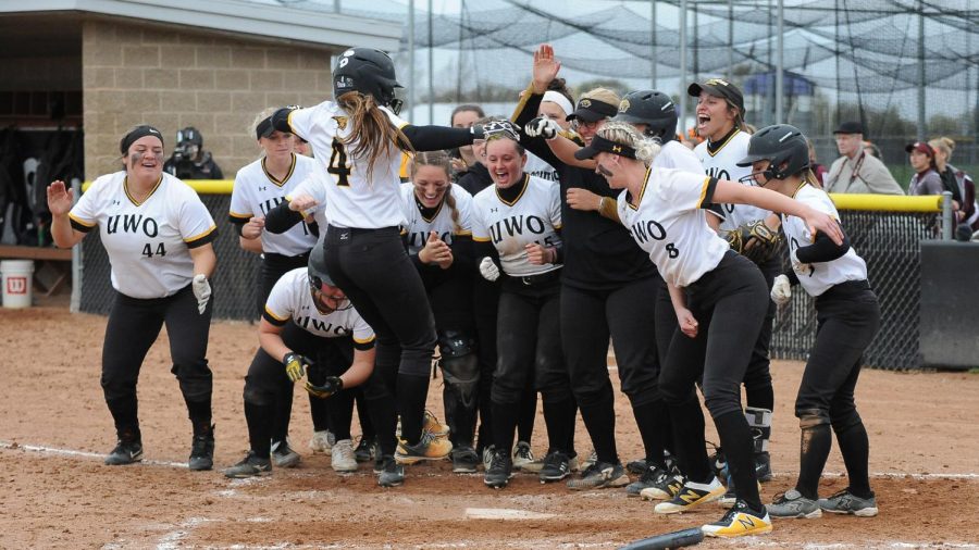 Kailee Garstecki’s surrounded by her teammates following her two-run homerun versus the Warhawks. The team finished the year with a 23-17 record.