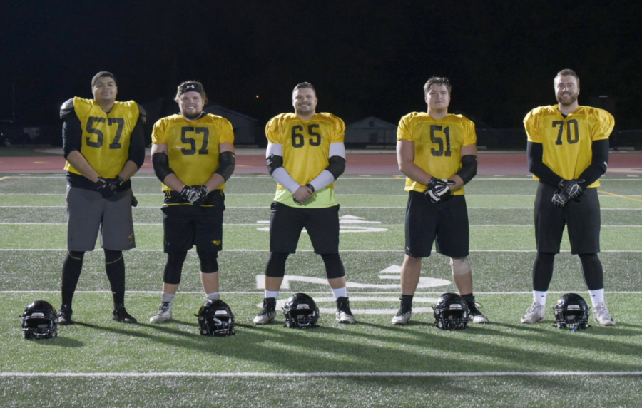 From left to right, Ameer Hollowell, Mike Olsen, Jason Myrick and Alex Wipperfurth pose after practice on Wednesday. Not pictured is injured senior Hunter Tank. 