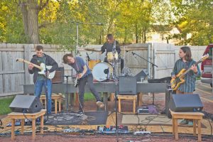The Present Age, started by two brothers, plays a backyard show in Oshkosh. 