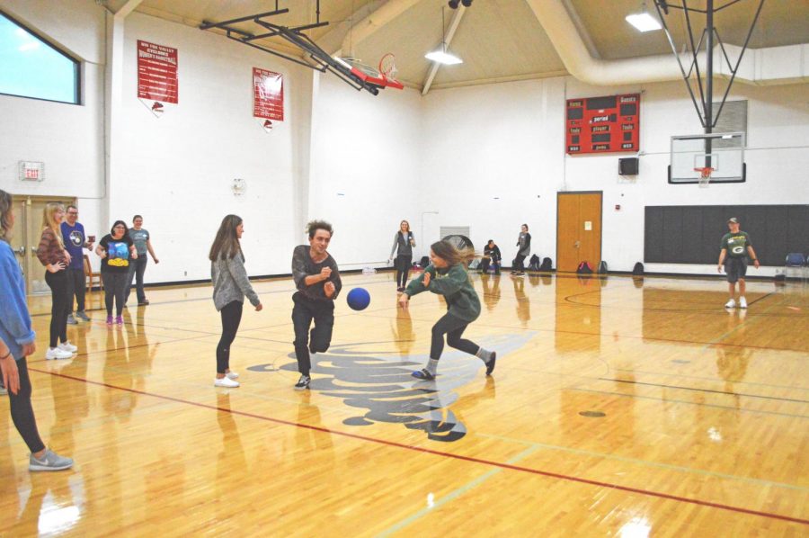 UWO-FC students enrolled in a service learning course play kickball with students from Thrive Career Academy
