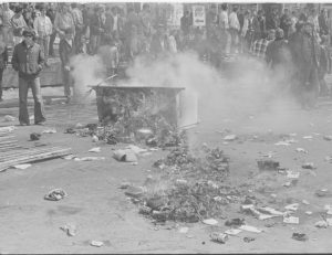 UW Oshkosh Archives Photo — In 1970, students on what is now UW Oshkosh lit tires and trash cans on fire to protest the war and Algoma Boulevard safety concerns.
