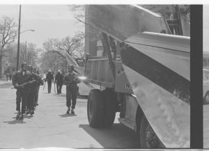 UW Oshkosh Archives Photo — Winnebago County Highway Department vehicles were used to clear Algoma Boulevard and reopen the road to traffic.