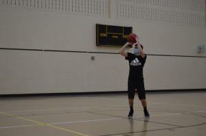 Sophomore Ben Gehrmann shoots a jump-shot in the intramural HORSE basketball tournament on Nov. 13 at 7 p.m. The event was held at the MAC gym in the SWRC with masks being required and basketball being provided.