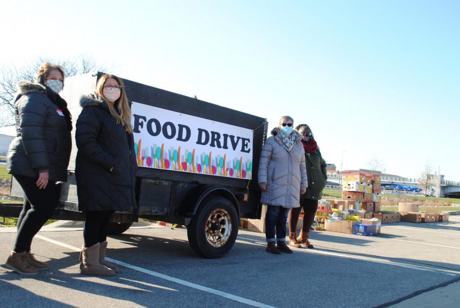 Volunteers collect food donations for Father Carrs Place.