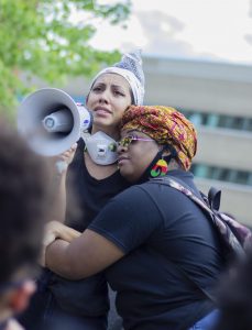 Carter Uslabar / Advance-Titan
Cassandra Ross, right, embraces a protester overcome with emotion at an Appleton Black Lives Matter protest in May 2020 following the murder of George Floyd at the hands of former Minneapolis police officer Derek Chauvin. Ross organized the Appleton protest, which marched down College Avenue before ending peacefully in Houdini Plaza and the intersections of Oneida Street and College Avenue.
