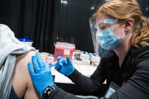 UWO Flickr — UWO nursing student Alexis Dietsche of Loyal, Wisconsin, prepares and administers a COVID-19 vaccine at a vaccine center at the Fox Cities Exhibition Center in Appleton on May 12.
