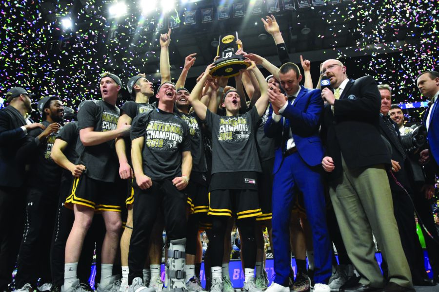 The+2019+Titan+men%E2%80%99s+basketball+team+holds+up+the+championship+trophy+in+front+of+their+faithful+fans+as+confetti+rains+down+around%0Athem.+It+is+their+first+national+championship+in+program+history.+%28Advance-Titan+file+photo%29+