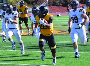 Josh Woolwine / Advance-Titan - Peter MacCudden breaks out on a long run against the Blugolds.