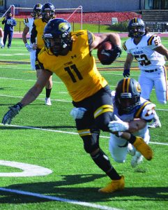 Josh Woolwine / Advance-Titan -Titan Tony Steger sheds a tackle in the UWO victory. Steger caught the first pass of the game and scored two touchdowns on the day.

