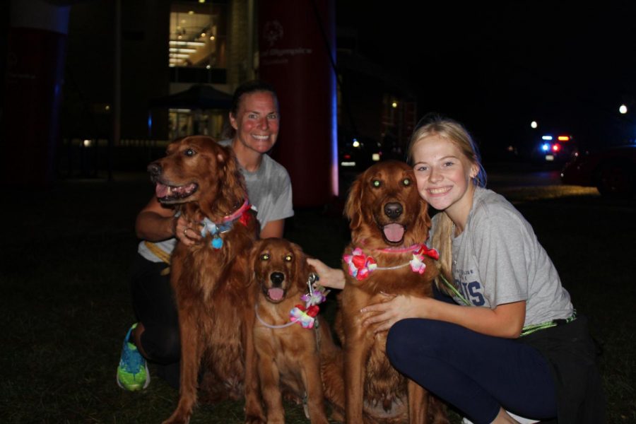 Katie Pulvermacher / Advance-Titan
Runner Shelly Birling (left) and her daugher (right) ran in the Run with the Cops 5k event on Oct. 7. All of the funds raised for the event directly benefit Special Olympics Wisconsin, which the Birling family supports. Squad cars were lit up all along the course for runners to see.