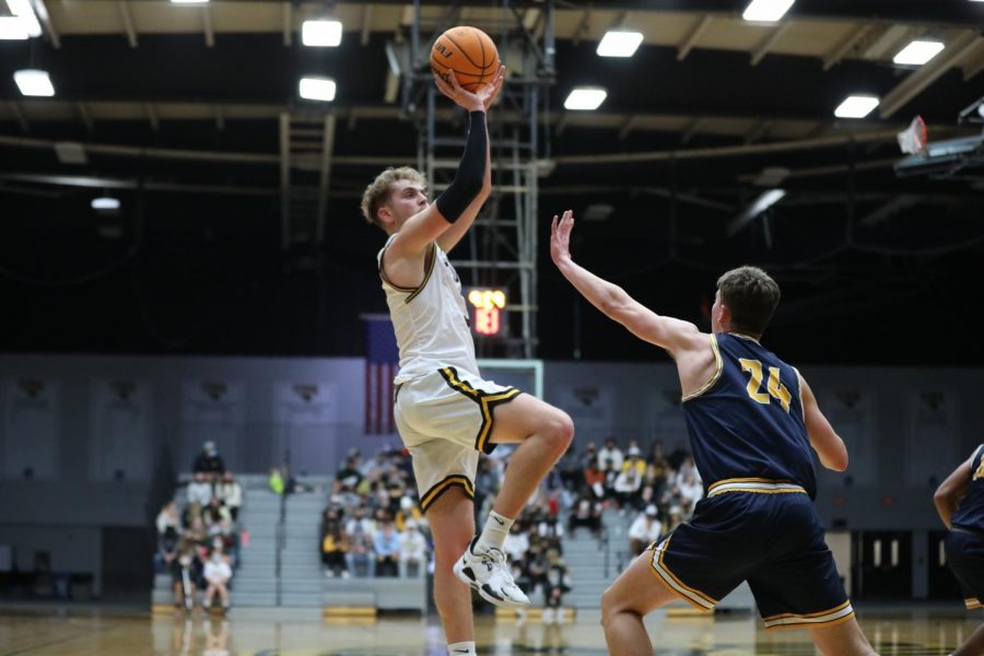 Courtesy of Steve Frommell
Eddie Muench goes for a shot. Muench put up 24 points in the team’s opening victory over Augustana.