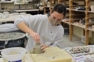 Katie Pulvermacher / Advance-Titan Emma Hathorne creates a pottery piece in her free time. Elsewhere’s goal of imperfection and realness makes for an inclusive environment where anybody with the time to create their own art work can go in and work