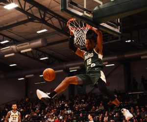 Jacob Link / Advance-Titan
The Herd’s Jalen Lecque hangs on the rim after a dunk on Sunday’s loss to the Fort Wayne Mad Ants.