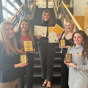 Courtesy of Greek Life — Alpha Xi Delta members with their awards