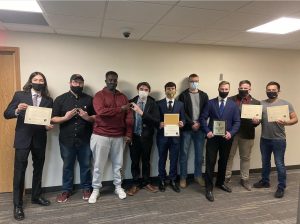 Courtesy of Omega Delta Phi — Omega Delta Phi with their awards including Fraternity of the Year, Excellence in Scholarship, Excellence in Civic Engagement, Outstanding Philanthropy Program and Most Improved GPA 