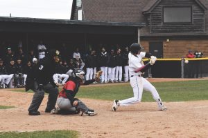 Jacob Link / Advance-Titan
Junior Matt Scherrman hits a double against Ripon College. The Titans out hit the Red Hawks 11-9 in Tuesday’s game at Teidemann Field.