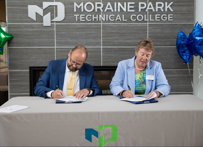 Photo: UWO Flickr — UW Oshkosh Chancellor Andy Leavitt and Moraine Park President Bonnie Baerwald sign the articulation agreement Friday.