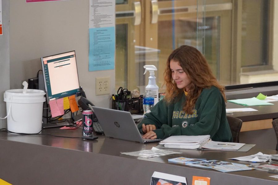 Photo courtesy: Willem Flaugher
Cutline: Kylee Nosbush works at the front desk in Fletcher Hall on top of being a student.