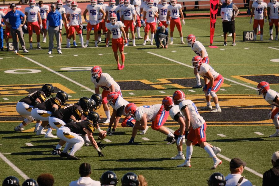 Photo+courtesy+of+UWO+Athletics--%0AThe+offensive+line+sets+up+on+center%2C+Brian+White.+Within+the+First+11+seconds+of+the+first+quarter+UWO+had+already+scored+a+touchdown.